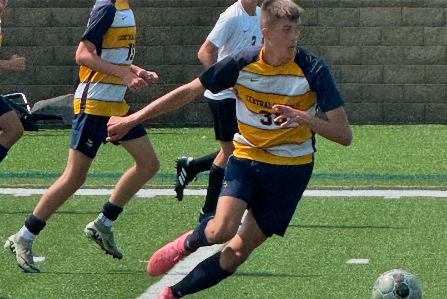 Finnley playing soccer